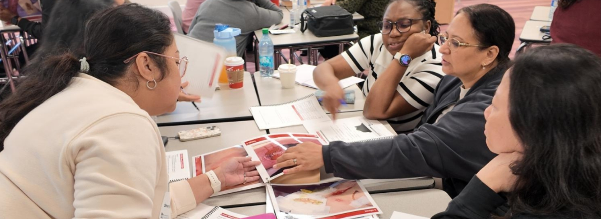 Participants work together during a hands-on wound care skills lab.